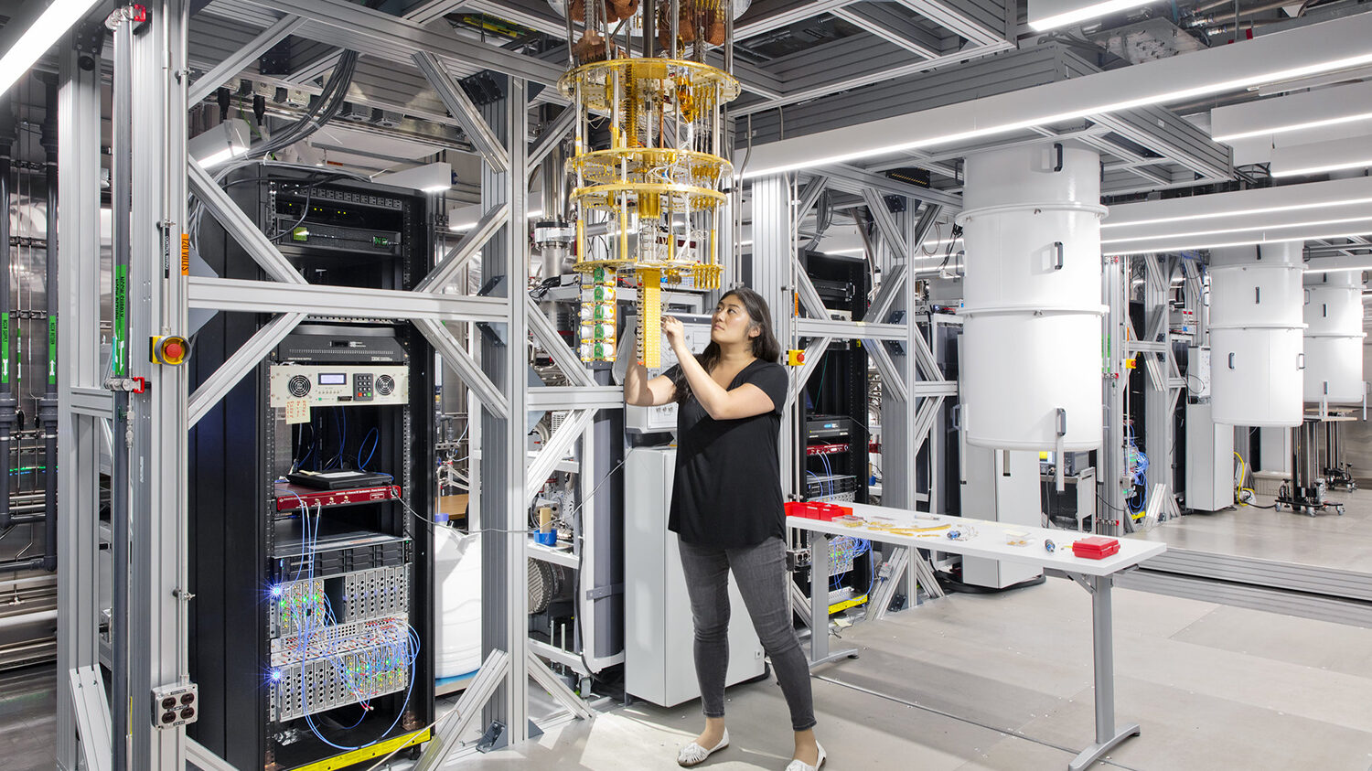 A woman works with quantum machinery