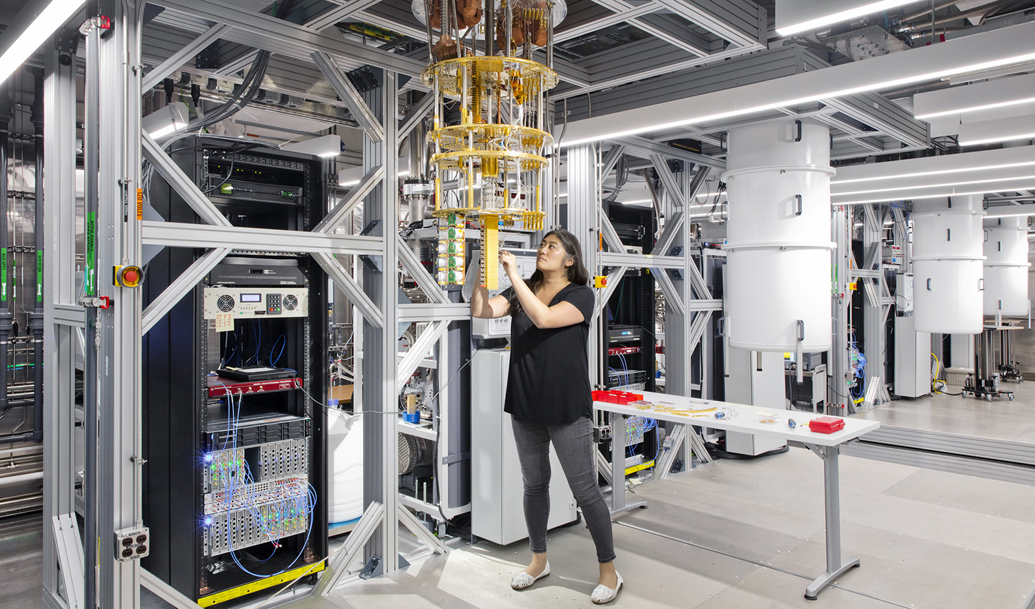 A woman works with quantum machinery